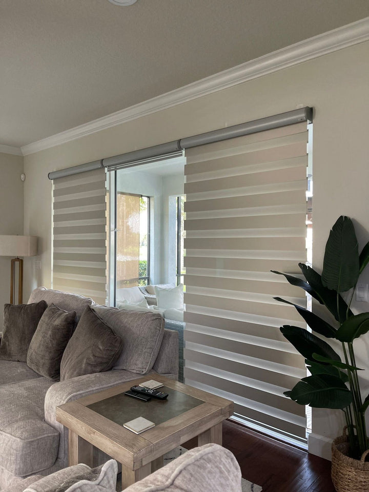 Zebra shades on a sliding glass door in a living room