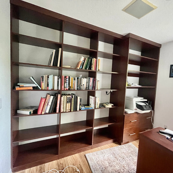 Wall of built-in bookshelves in a home office